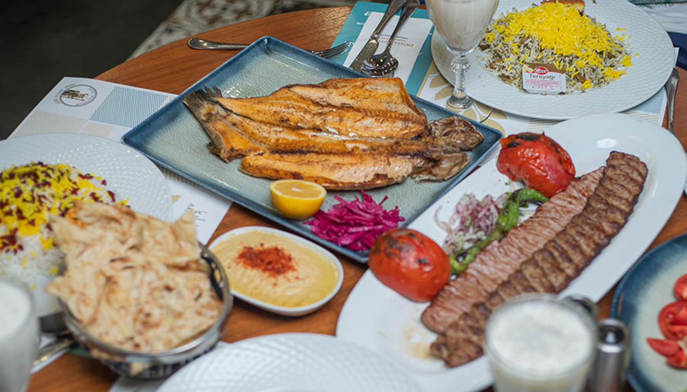 Experience the Tersane Istanbul Rowing Festival and explore the best cuisines nearby. From Persian cuisine at Ariya Restaurant to seafood at Karaköy, discover the must-try dishes that will make your visit an unforgettable experience.